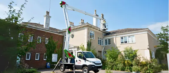 using our cherry picker on a commercial gutter cleaning job in Filwood, Devon