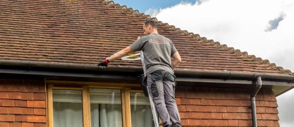 our team cleaning the gutters on a house in Stoke Bishop, Devon